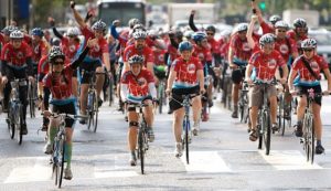 Bicyclists riding down the street during a Climate Ride event