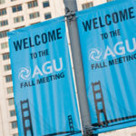 A photograph of a blue street sign in San Francisco that reads "Welcome to the AGU Fall Meeting"